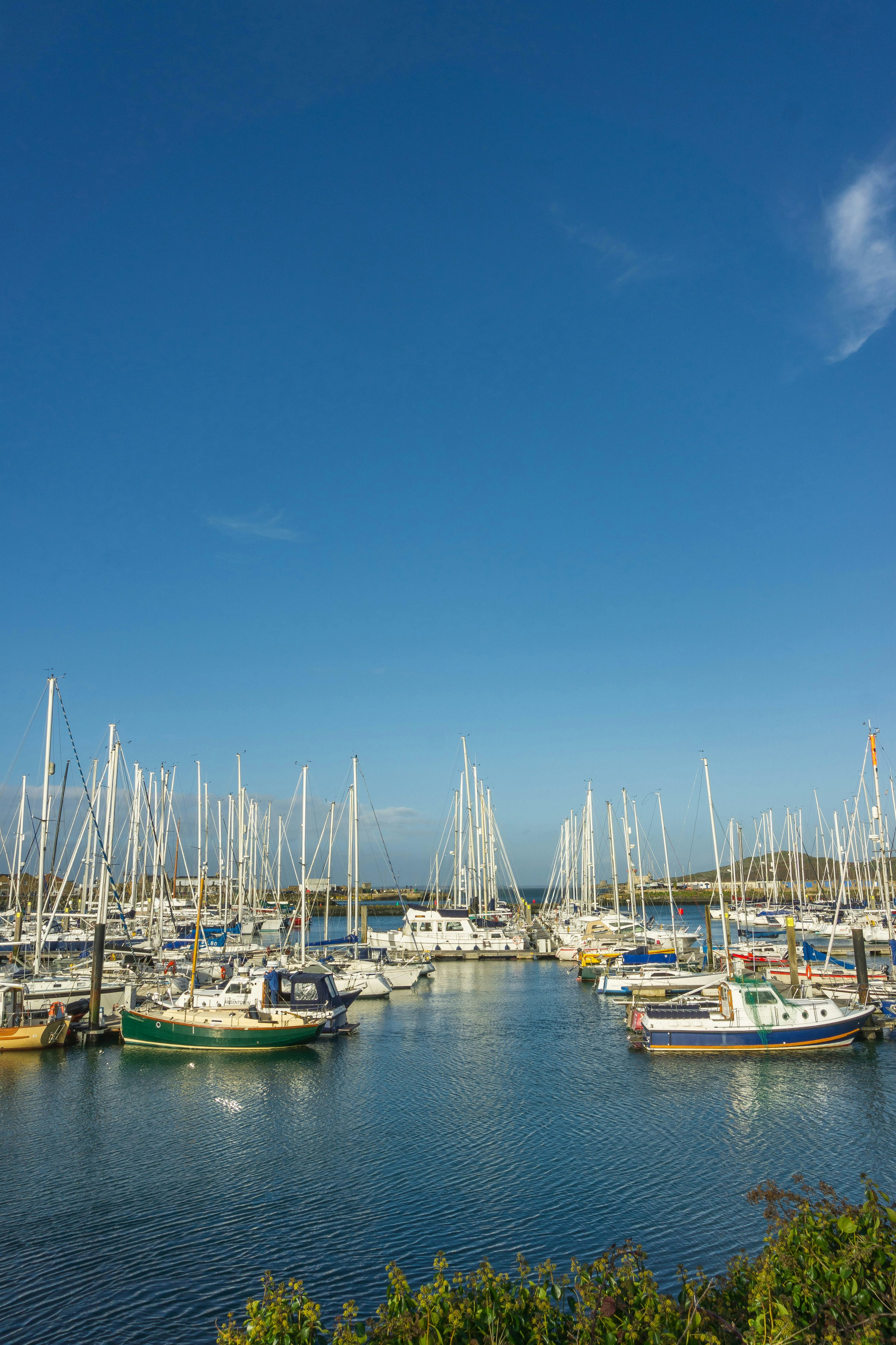 Boats in Howth marina, Dublin, beneath a clear blue sky